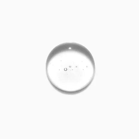 Clear droplet of Kerastase Bain Après-Soleil shampoo for removing chlorine and salt from hair.