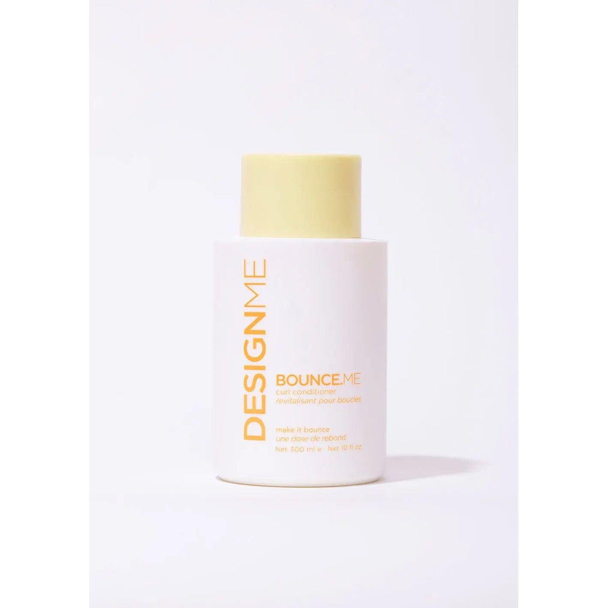 Bounce.Me Curl Conditioner bottle with creamy formula; moisturizes, enhances shine, protects color, and provides anti-static benefits.