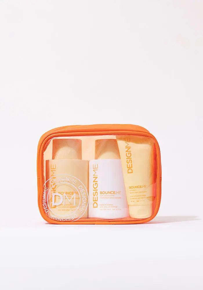 BOUNCE.ME Curl Glitz Kit for defined curls in orange travel case, includes shampoo, conditioner, and curl balm for 2A to 4C hair types.
