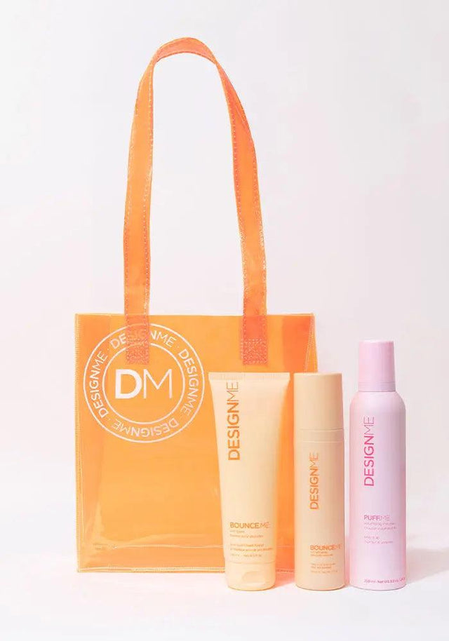 BOUNCE.ME Curl Glow & Go Kit with curl balm and styling essentials for wavy, curly, coily hair in orange carry bag.