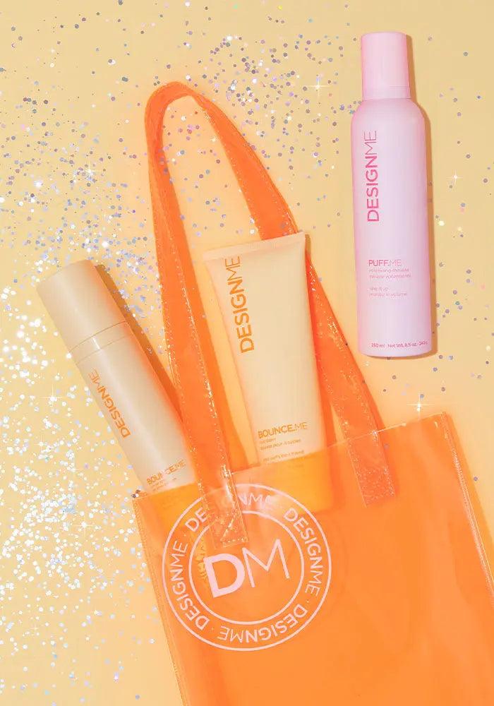 BOUNCE.ME Curl Glow & Go Kit with curl balm, nourishing for wavy, curly hair. Includes three-step styling set in orange bag.