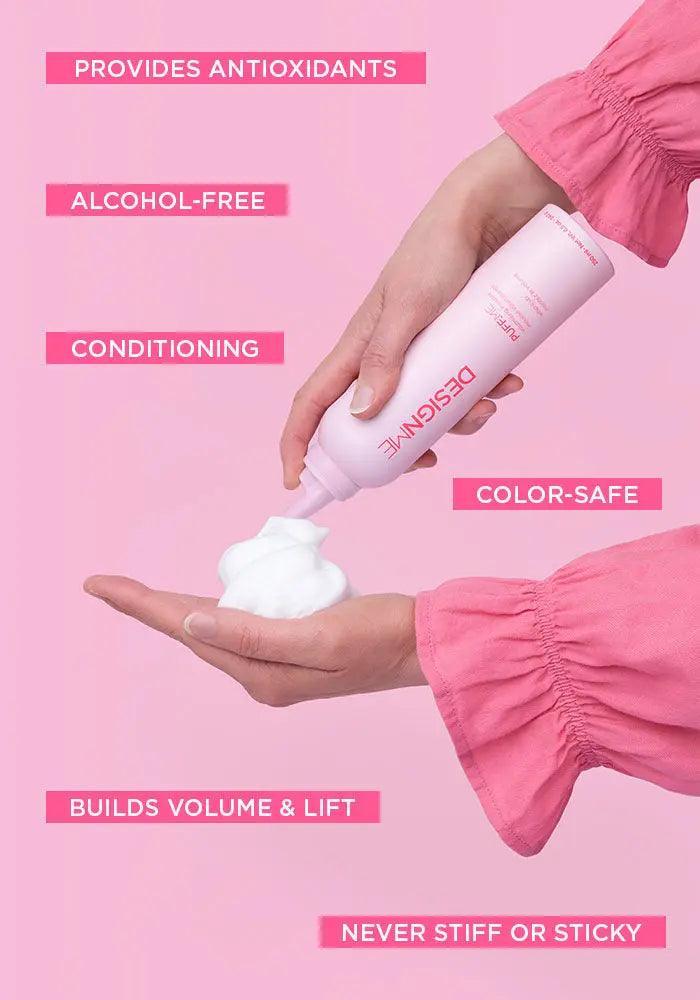 Pouring pink bottle of hair conditioning foam highlighting features: alcohol-free, color-safe, builds volume, never sticky, adds antioxidants.