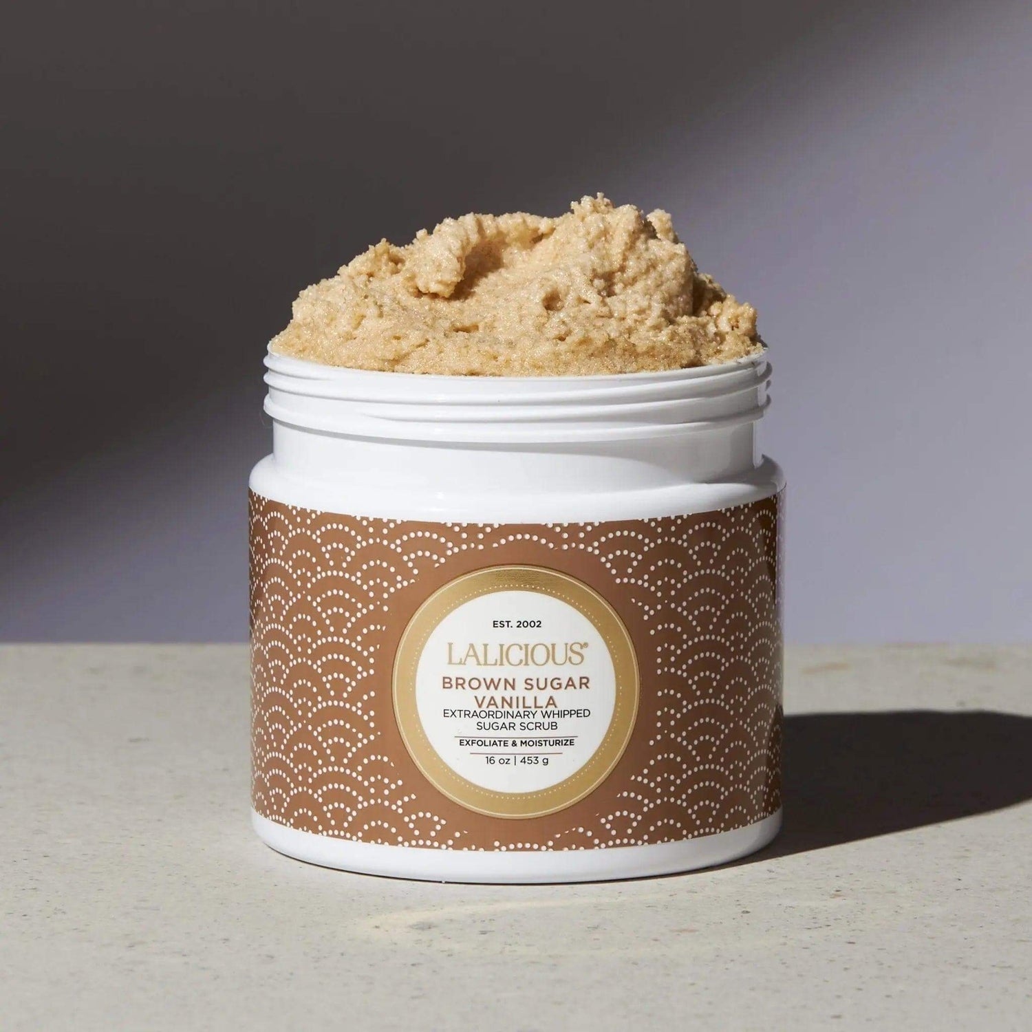 Brown Sugar Vanilla Sugar Scrub jar showcasing rich texture and premium body care exfoliant.