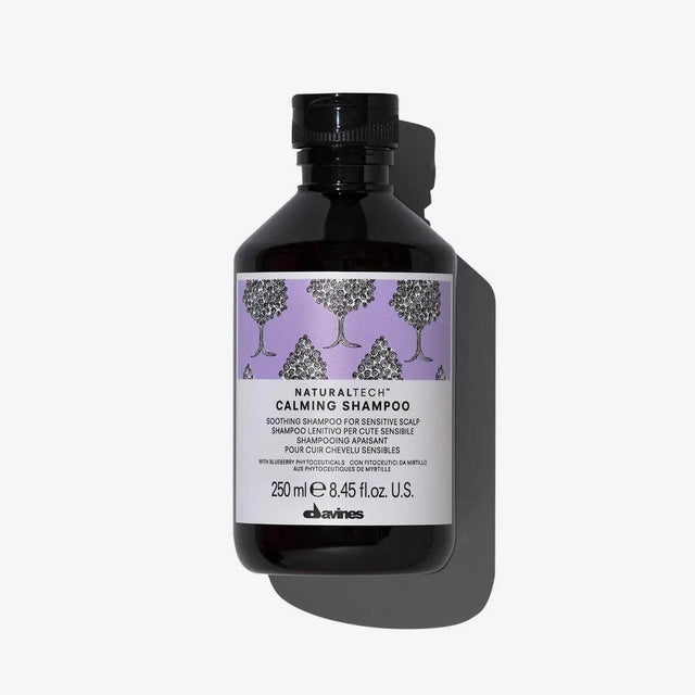 Davines Calming Shampoo bottle for soothing and hydrating sensitive scalps, featuring a natural, sulfate-free formula.