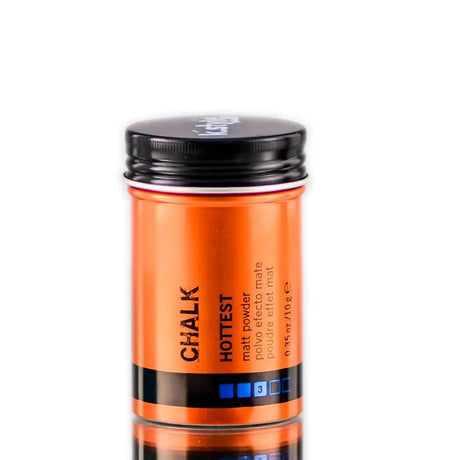 Orange Chalk Matt Powder bottle for versatile hair styling, offering increased volume and a matte, natural look. Suitable for all hair types.