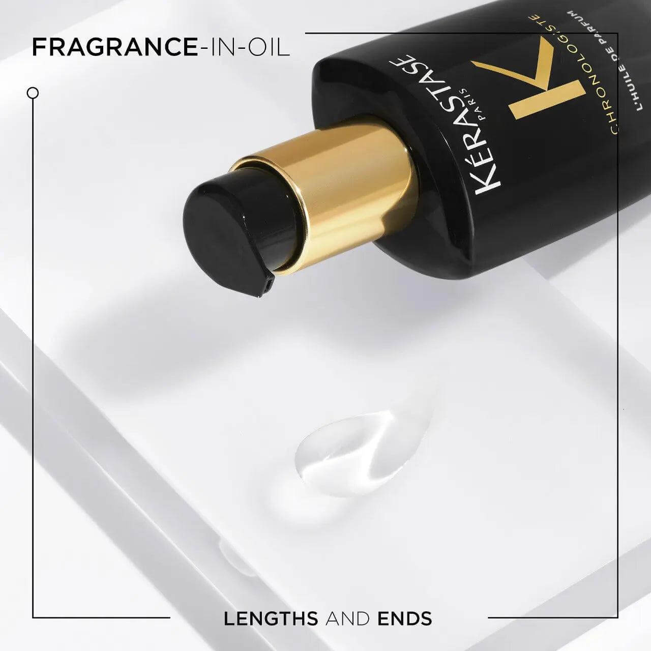 Kérastase Chronologiste Huile De Parfum hair oil bottle with drop on surface, enhancing shine and nourishment for all hair types.