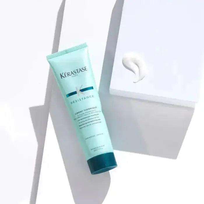 Kérastase Ciment Thermique leave-in cream for heat protection and hair repair on white background with product swatch.