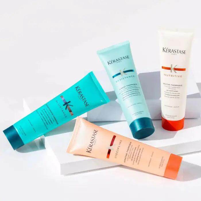 Kerastase hair care products display including Ciment Thermique, designed for heat protection, damage repair, and shine enhancement.