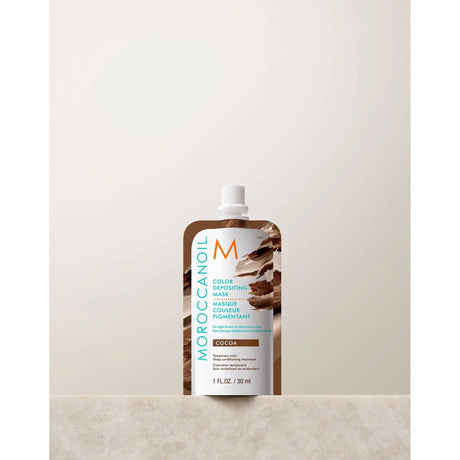 Moroccanoil Color Depositing Mask 30ml on marble surface, restores hair color and shine with argan oil conditioning formula.
