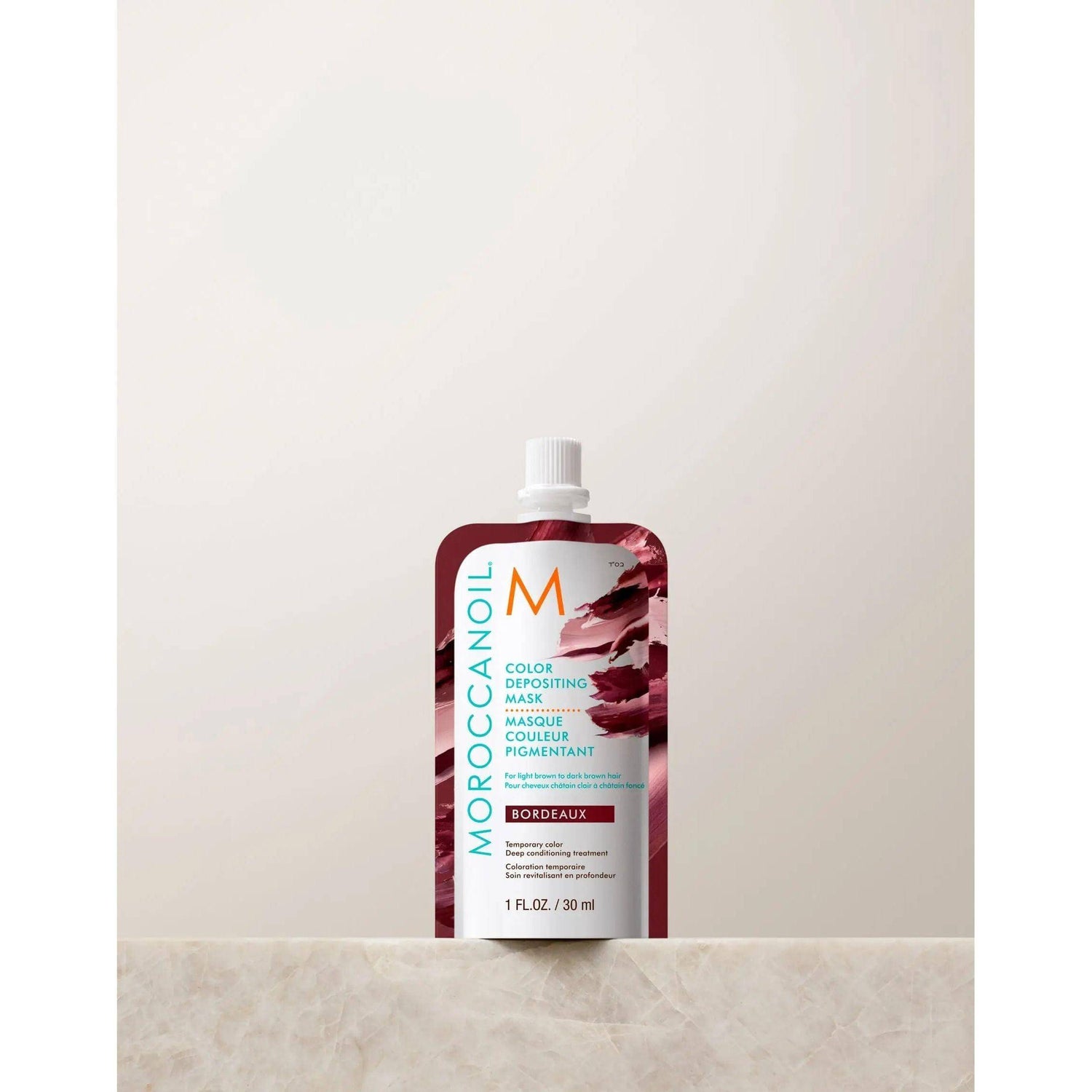 Moroccanoil Color Depositing Mask 30ml for reviving hair color with argan oil shine, ideal between salon visits for eliminating brassiness.