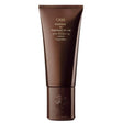 Oribe Conditioner for Magnificent Volume bottle for lightweight, voluminous hair care.