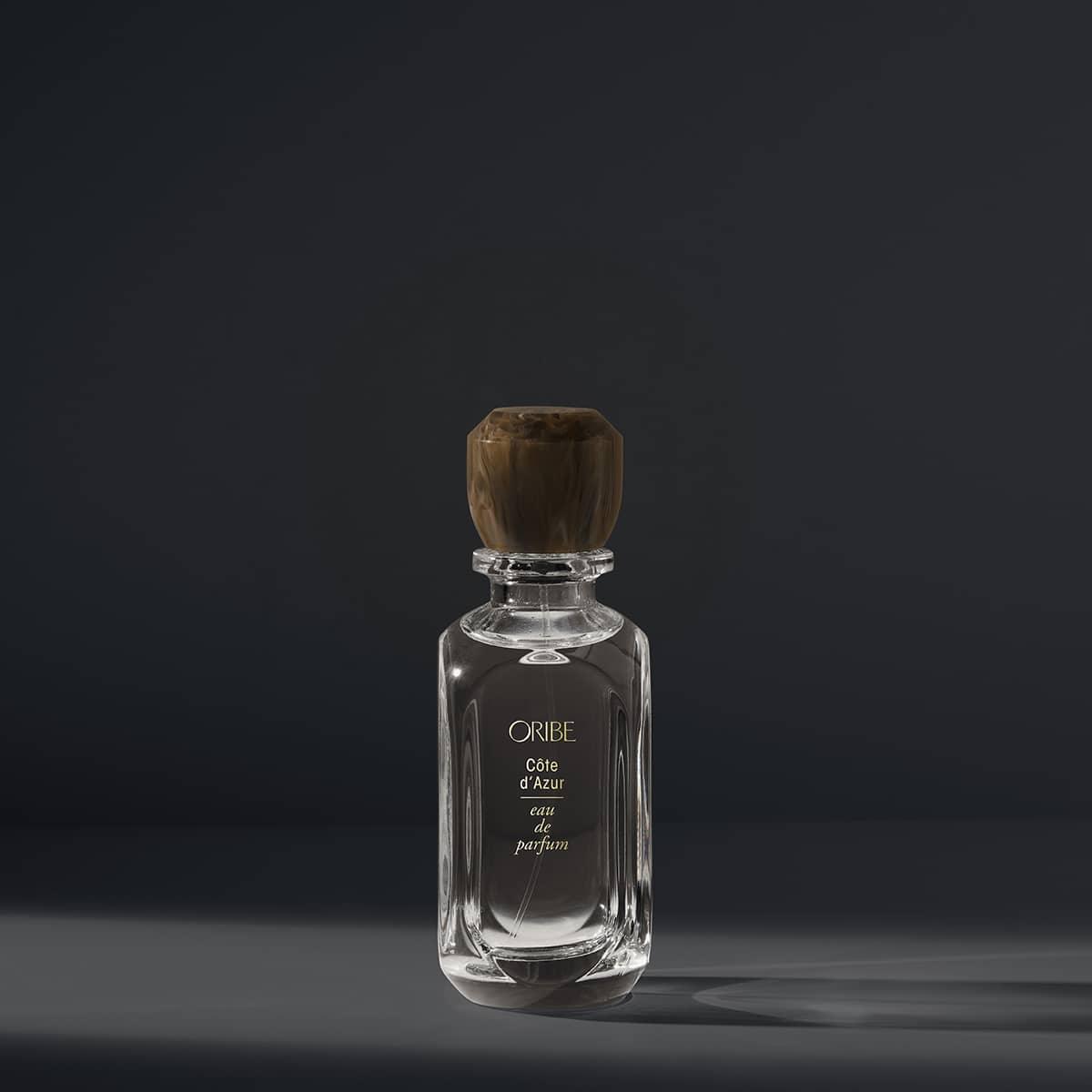Luxurious Côte D’Azur Eau De Parfum bottle with notes of bergamot, jasmine, and sandalwood in elegant packaging.