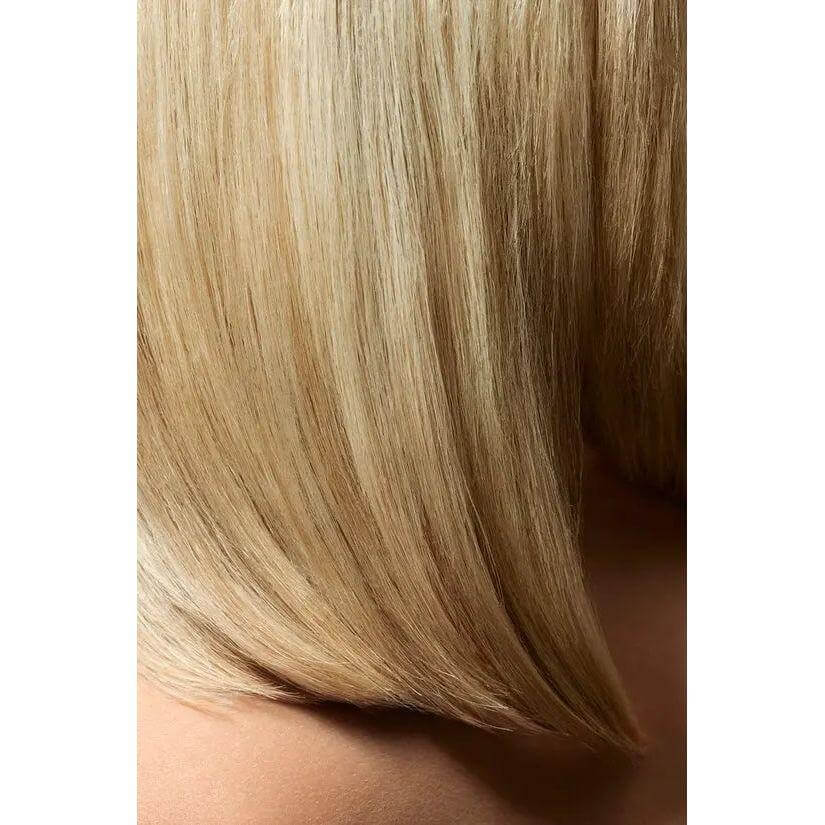 Sleek, shiny blonde hair styled to perfection, showcasing the smooth finish of the Creme For Style hair product.