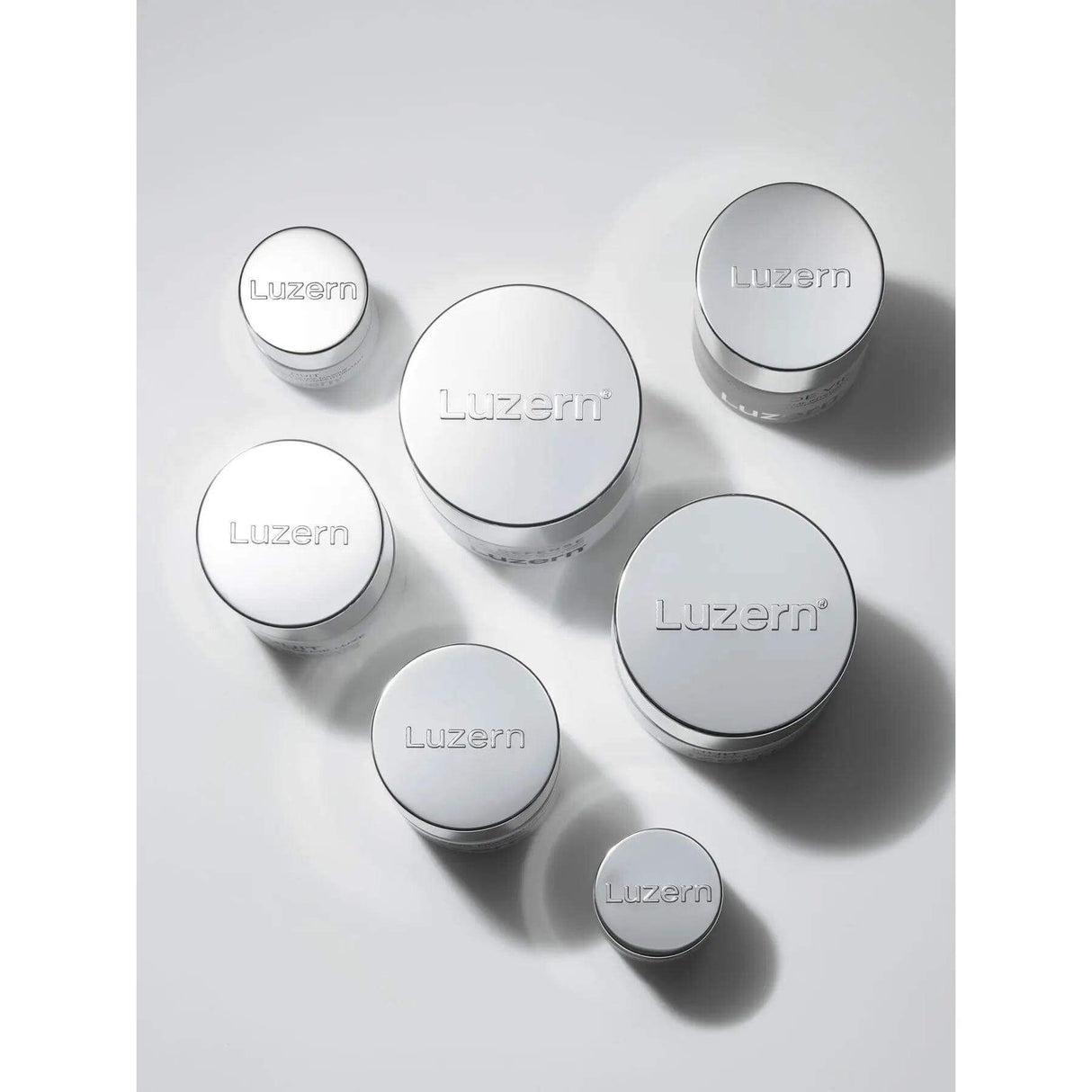Luzern Crème Nuit luxury skincare jars for nighttime neck treatment with Swiss Alpine Extracts, Retinol, and Peptides.