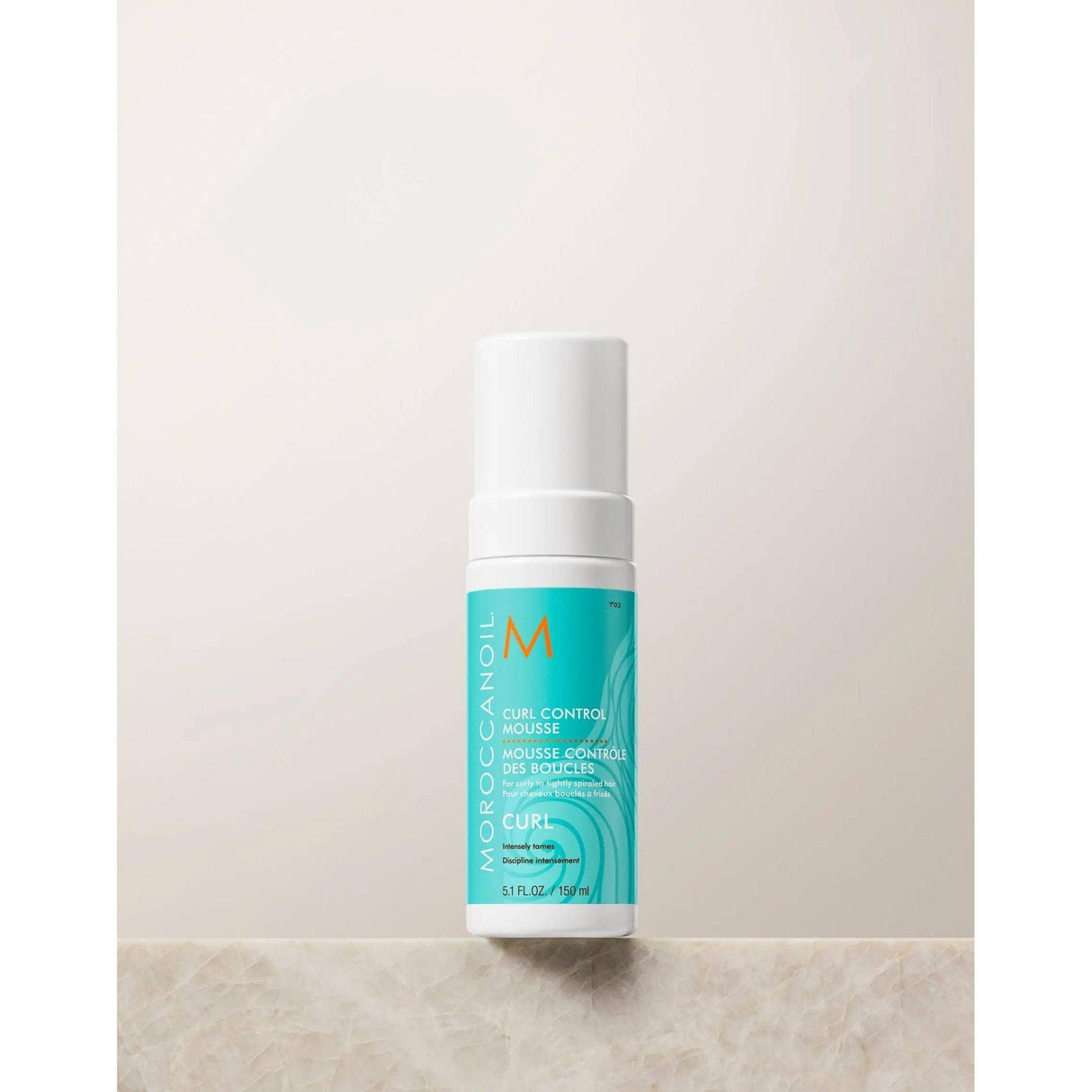 Product image of Moroccanoil Curl Control Mousse bottle for curl definition and frizz control, enriched with argan oil.