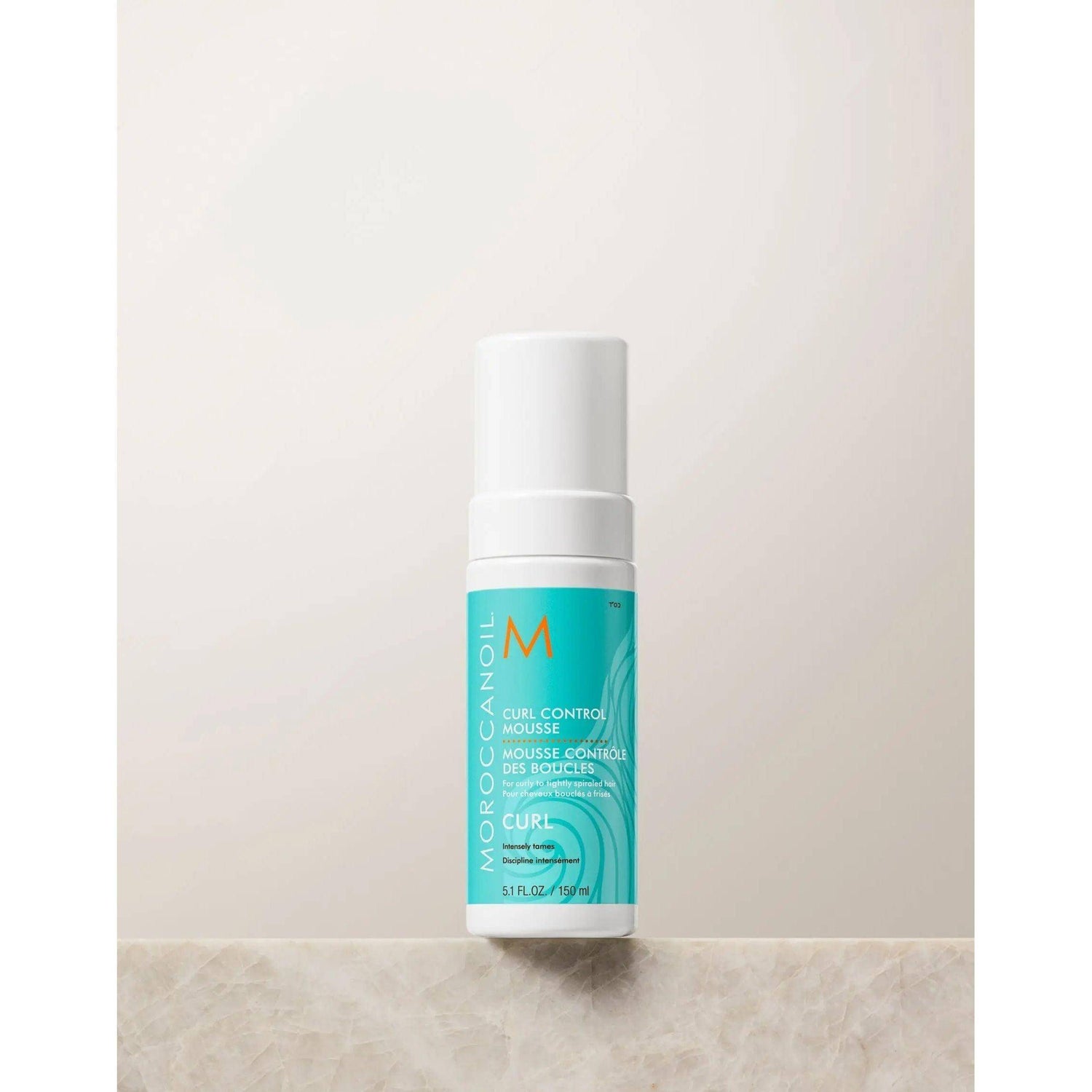 Product image of Moroccanoil Curl Control Mousse bottle for curl definition and frizz control, enriched with argan oil.
