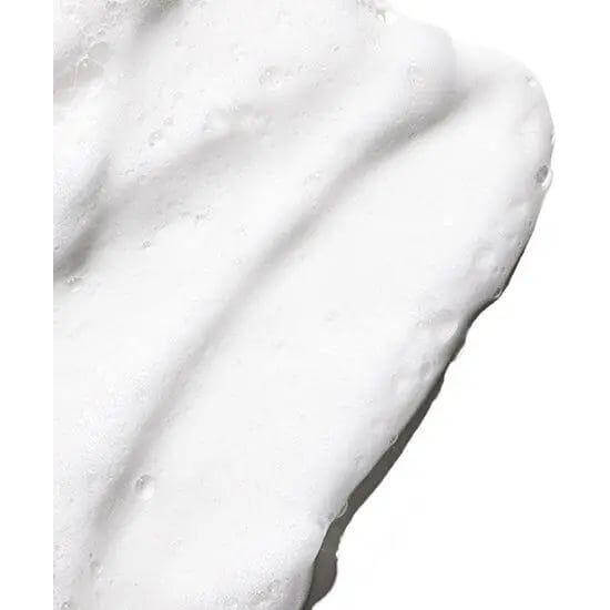 Close-up of Moroccanoil Curl Control Mousse texture, highlighting its smooth and lightweight formula for defining and taming curls.