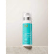 Bottle of Moroccanoil Curl Defining Cream for conditioning curly and wavy hair, enhancing curls with shine and humidity resistance.