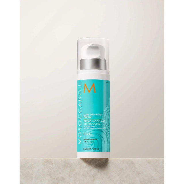 Bottle of Moroccanoil Curl Defining Cream for conditioning curly and wavy hair, enhancing curls with shine and humidity resistance.