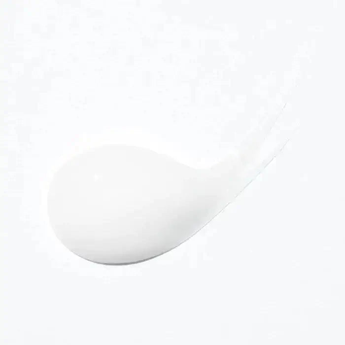 Swirl of Kerastase Curl Manifesto Gelée Contour defining gel for enhancing curls and controlling frizz, suitable for all hair types.