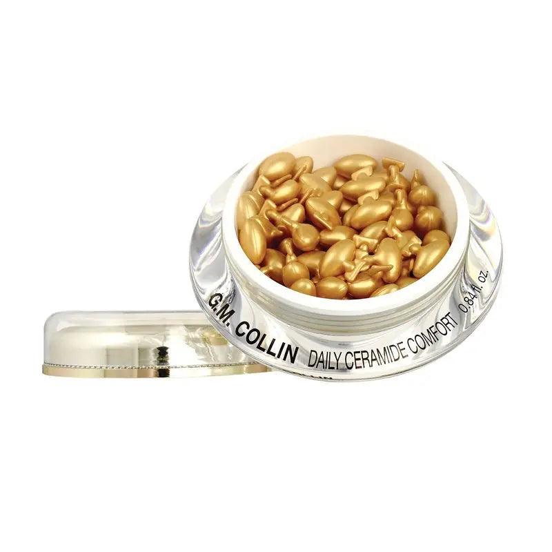Daily Ceramide Comfort capsules for skin nourishment and anti-aging, open jar showing gold capsules to restore and protect skin moisture.