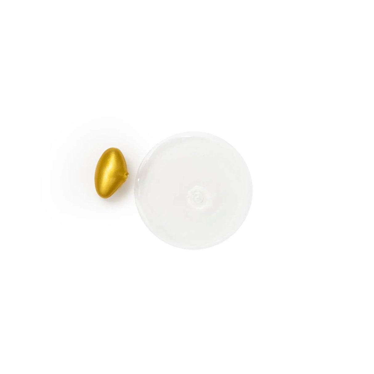 Golden capsule beside clear serum, illustrating Daily Ceramide Comfort's nourishing skincare benefits and moisture restoration.