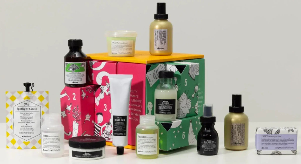 Davines Advent Calendar Gift Set with 12 mini hair essentials, including Oi Conditioner and Love Shampoo Bar, displayed against a white background.
