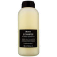 Davines Essential Haircare OI Shampoo Liter bottle with nourishing Roucou oil for soft, shiny hair and long-lasting fragrance.