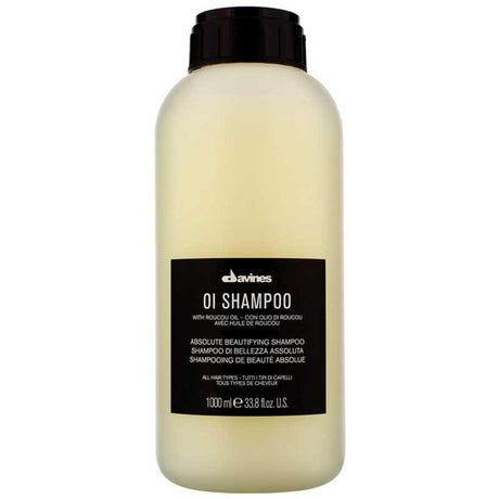 Davines Essential Haircare OI Shampoo Liter bottle with nourishing Roucou oil for soft, shiny hair and long-lasting fragrance.