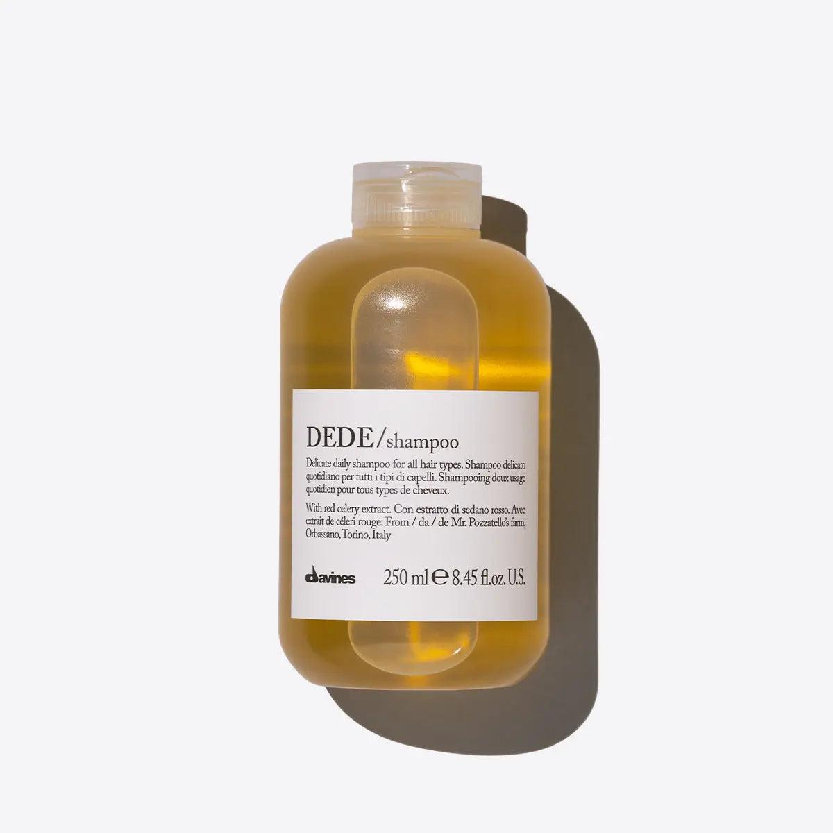 Bottle of Dede Shampoo, a hydrating hair care solution for all hair types, offering gentle cleansing and natural shine on a neutral background.