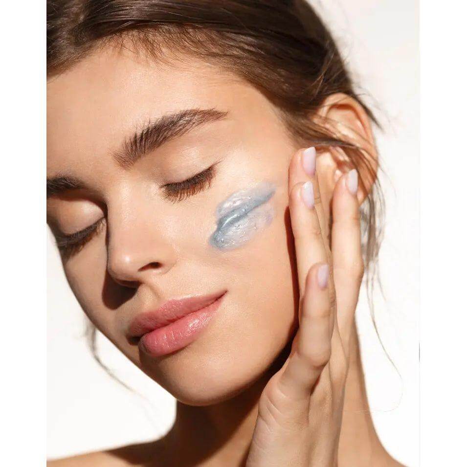 Woman applying deep peeling treatment for pore cleansing and exfoliation, promoting clear skin and youthful complexion.