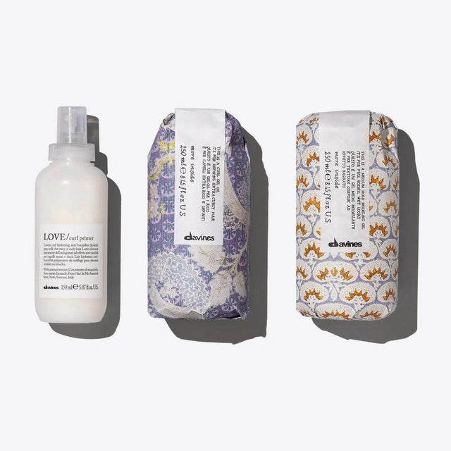 Davines Defined Curls Set with Love Curl Primer, Love Curl Gel Oil, and Medium Hold Modeling Gel for vibrant, healthy curls.