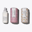 Davines Defined Waves Set featuring Love Curl Primer, Curl Building Serum, and Medium Hold Modeling Gel for defined, bouncy waves.