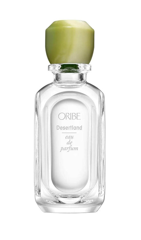 Desertland Eau De Parfum bottle with notes of juniper berry, lavender, pine, and cedarwood, capturing the essence of a vibrant desert.