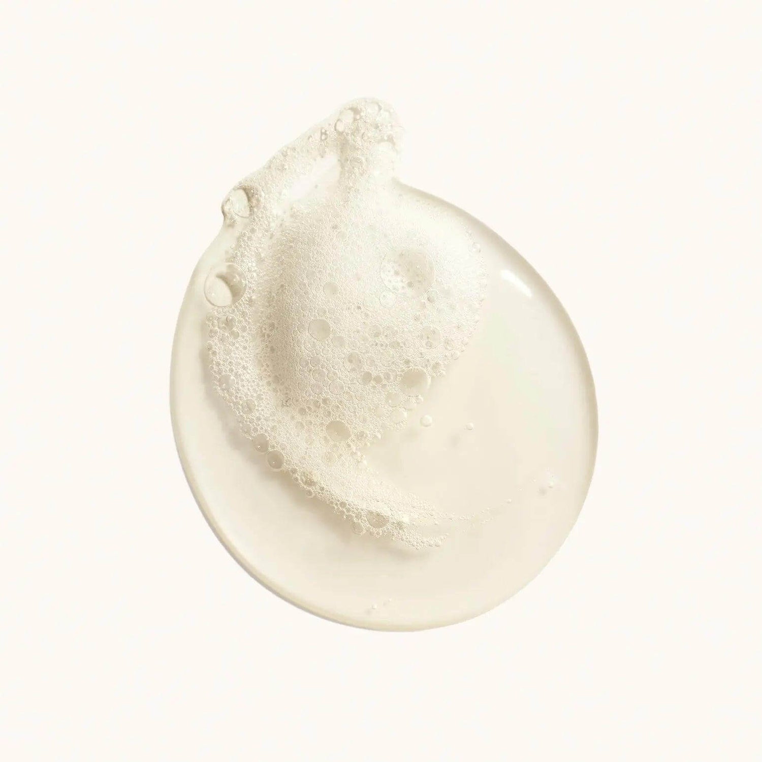 Luxurious lather of Desertland Replenishing Body Wash, showing rich pearlescent bubbles for gentle purification and skin nourishment.