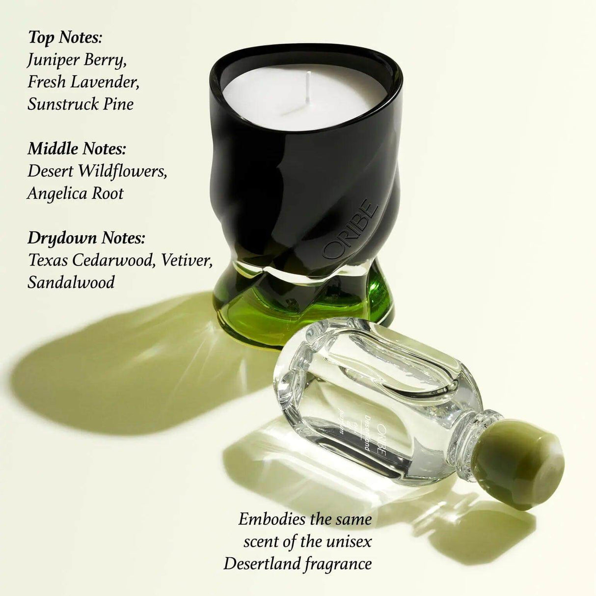Desertland scented candle with notes of juniper berry, lavender, pine, cedarwood, featuring a sleek black and green design.