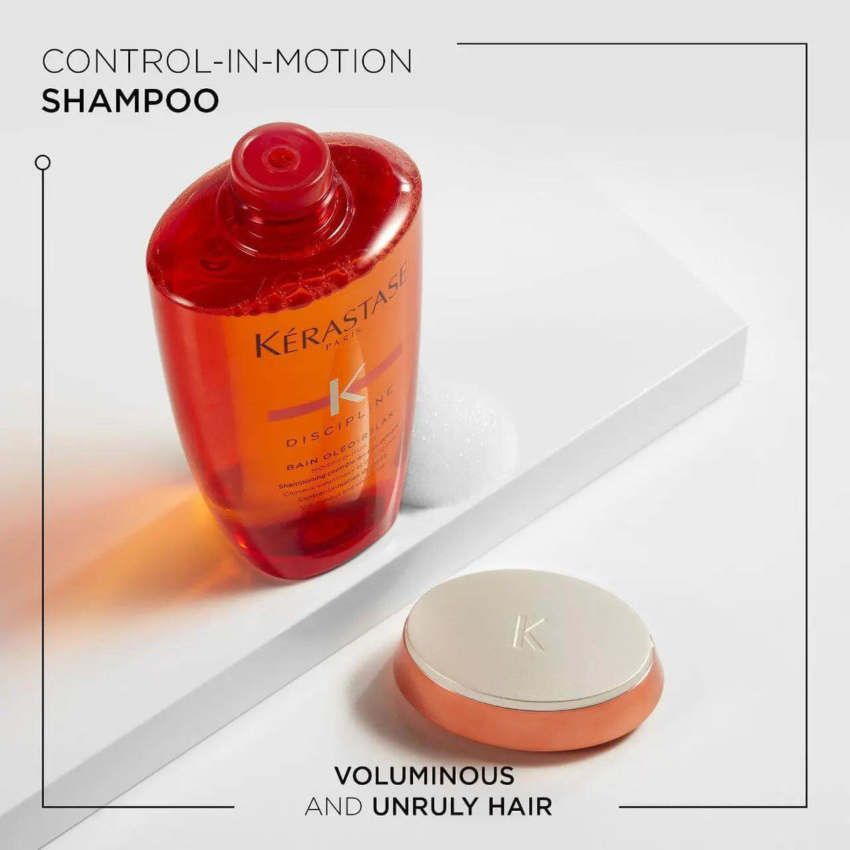 Kérastase Discipline Bain Oléo-Relax Shampoo bottle on white background, controls frizz and smooths unruly hair.