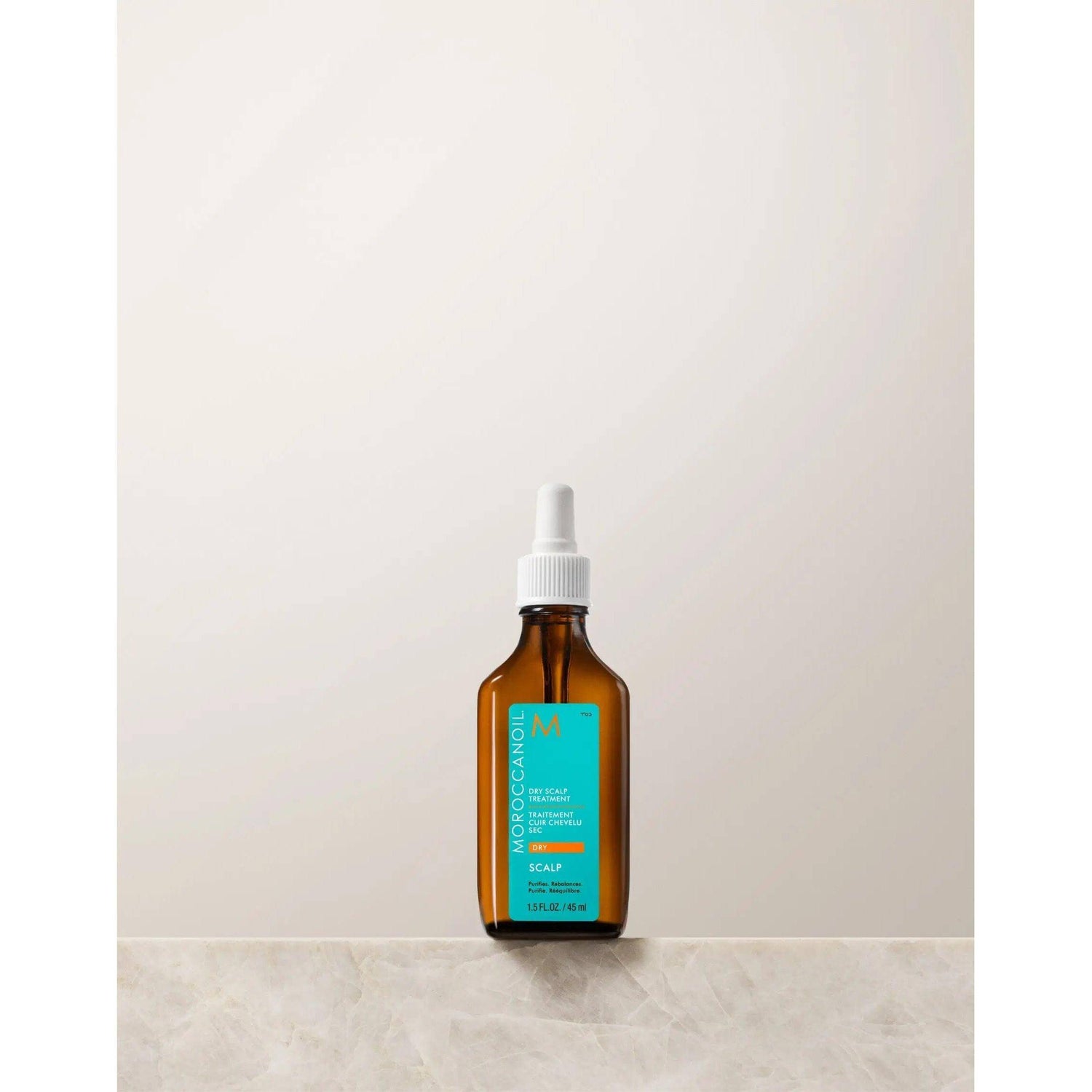 Moroccanoil Dry-No-More Professional Scalp Treatment bottle with natural ingredients for dry scalp repair and hydration.