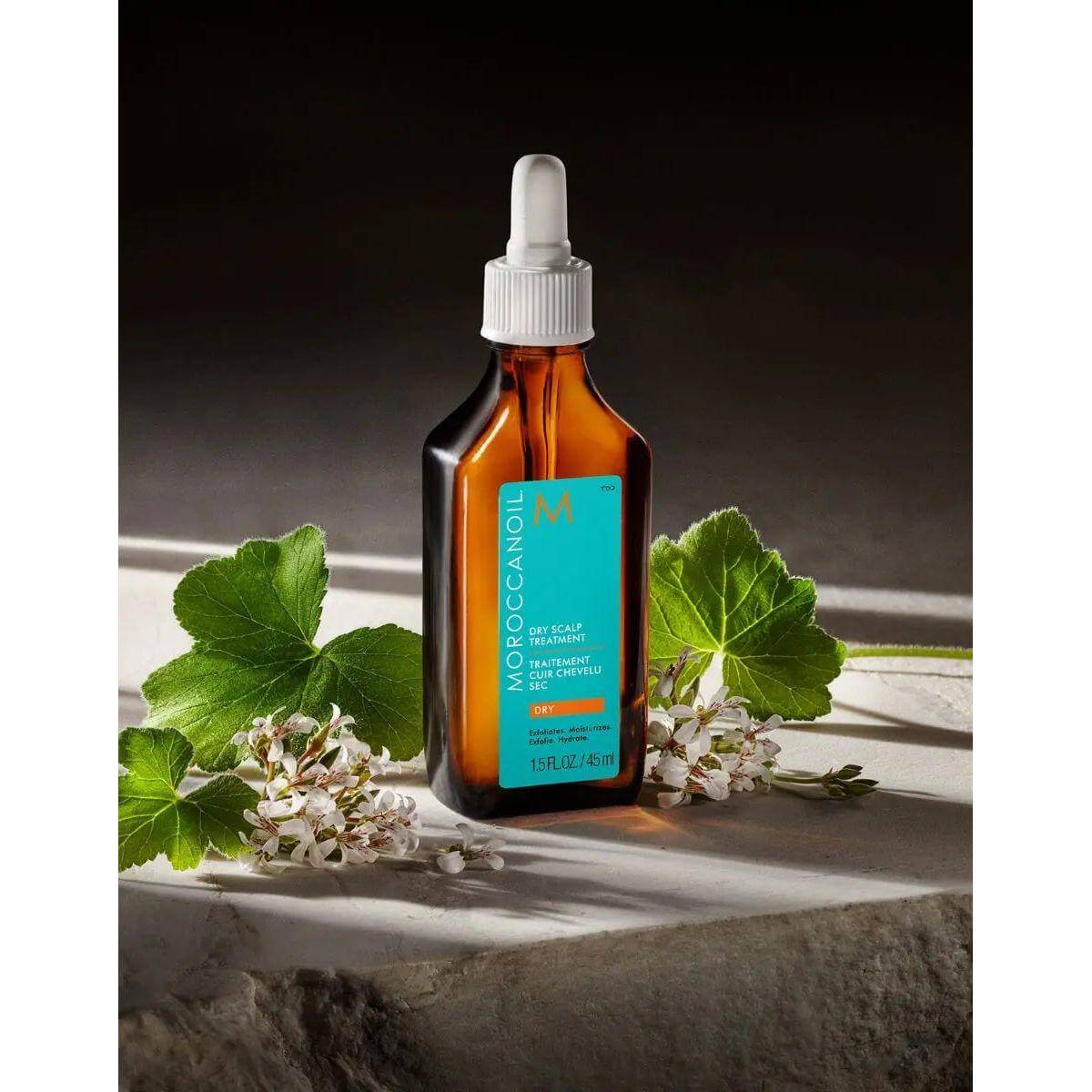 Moroccanoil Dry Scalp Treatment bottle with natural ingredients, including geranium and argan oil, for hair revitalization.