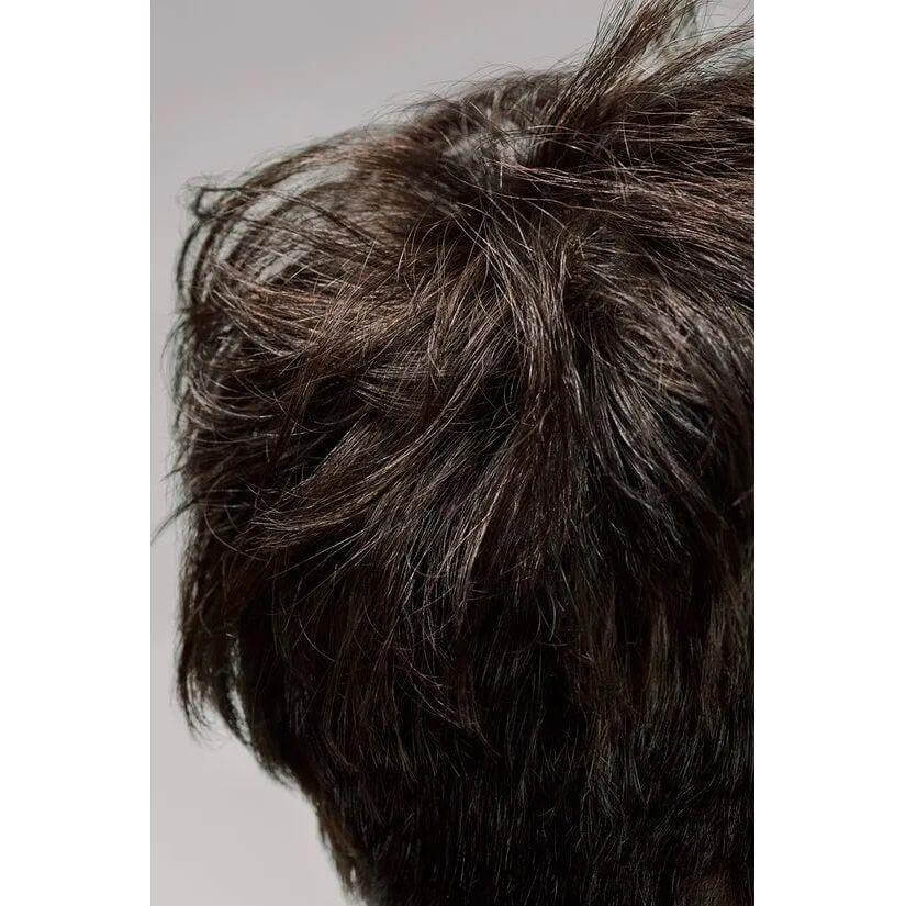 Close-up of styled hair showcasing volume and texture with dry texturizing spray for better hold and reduced flyaways.