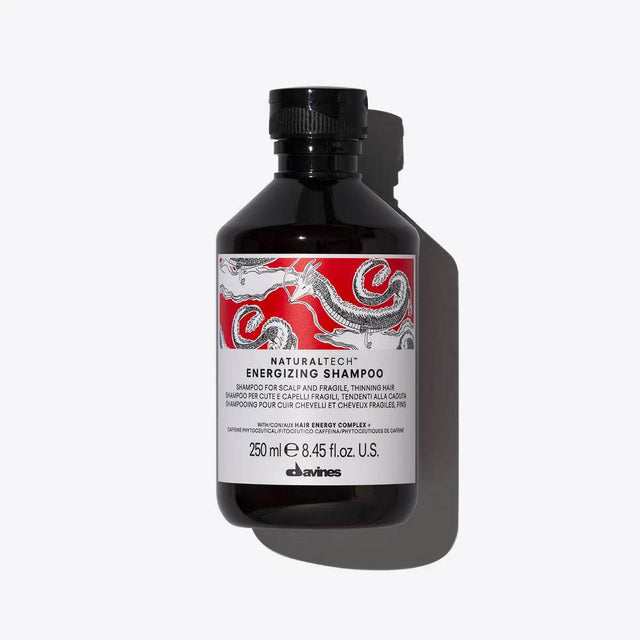 Davines Energizing Shampoo bottle, rejuvenating hair care for vitality and refreshment. Natural ingredients for healthy hair.