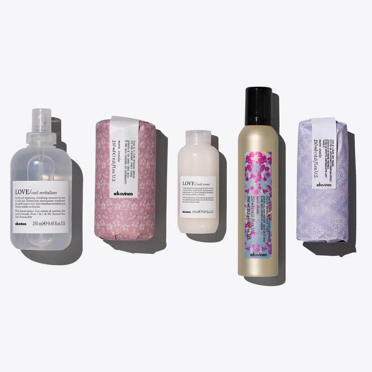 Davines Everyday Curls Set featuring five hair care products for curly hair, includes serum, cream, and mousse for bouncy curls.