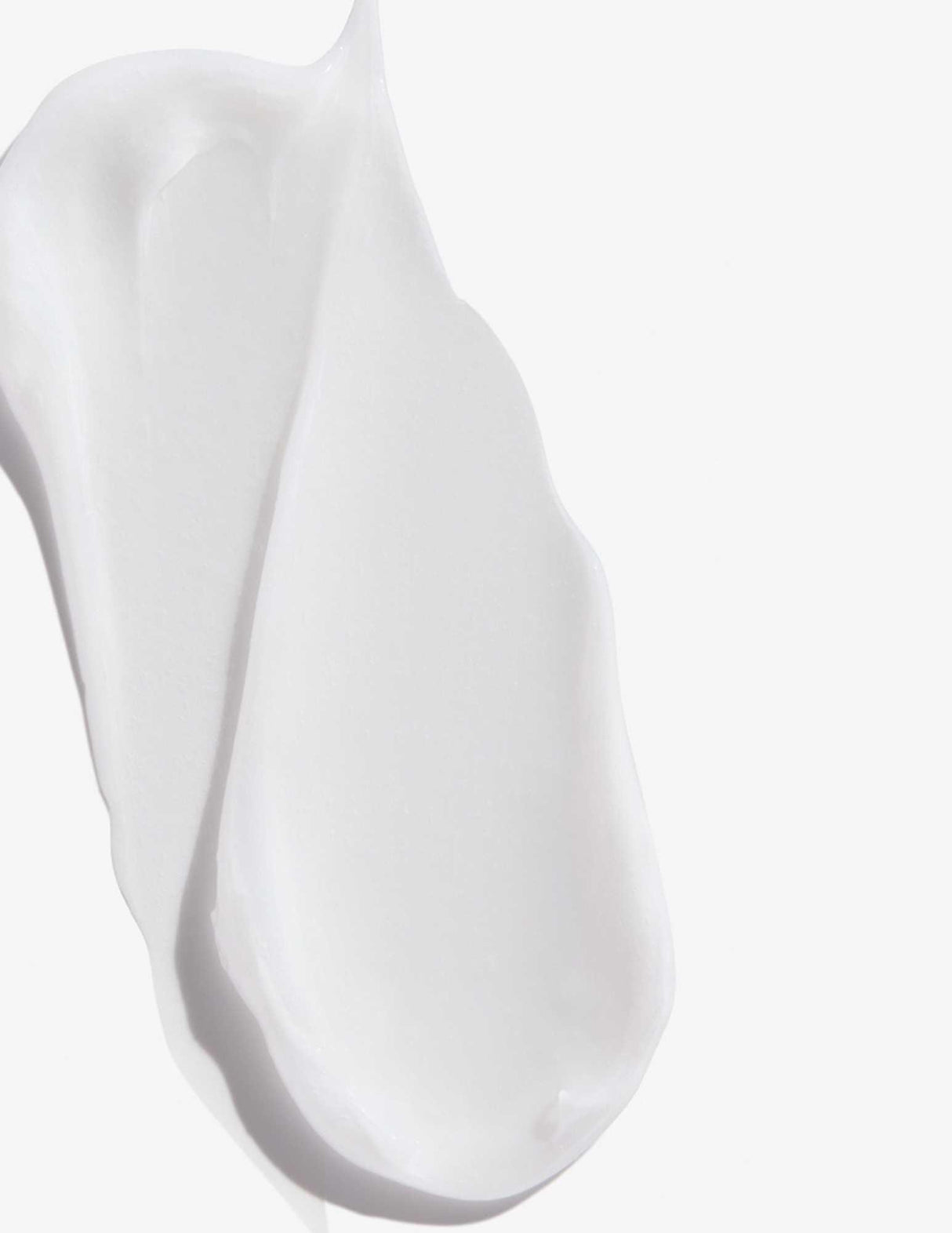 Swatch of Redken Extreme Length Conditioner with creamy texture for strengthening hair.