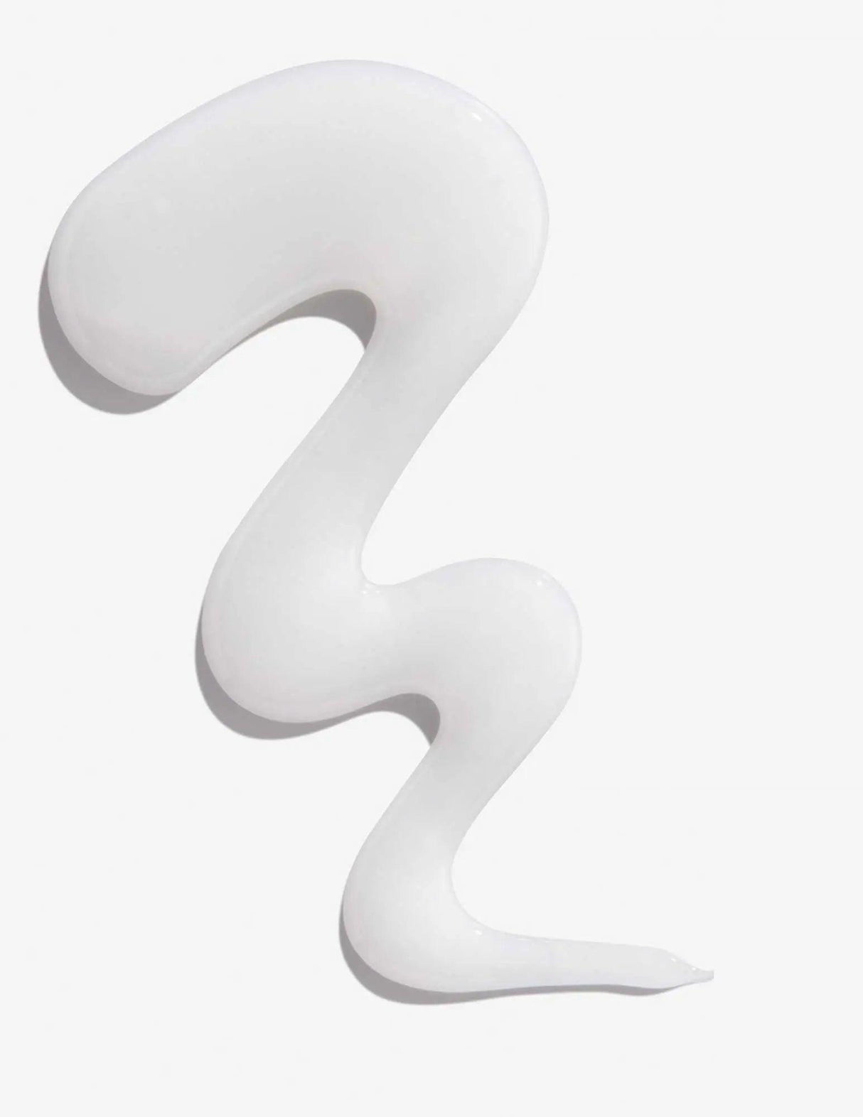 Texture of Redken Extreme Shampoo showing white creamy consistency.