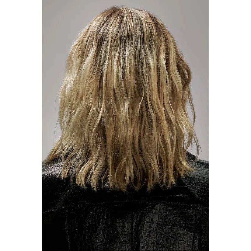 Blonde hair styled with Flash Form Finishing Spray Wax for a natural, airy texture.