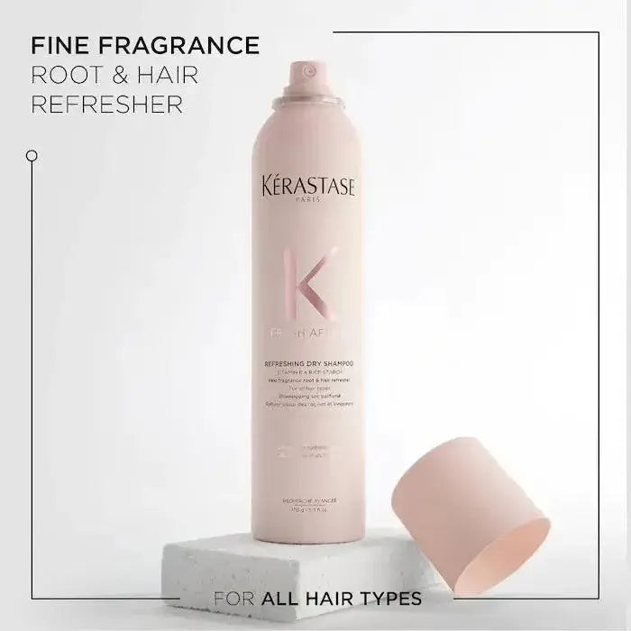 Kérastase Fresh Affair Dry Shampoo bottle, oil-absorbing formula for all hair types, shown with cap beside on a textured surface.