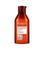 Redken Frizz Dismiss Conditioner bottle for reducing frizz and smoothing all hair types.