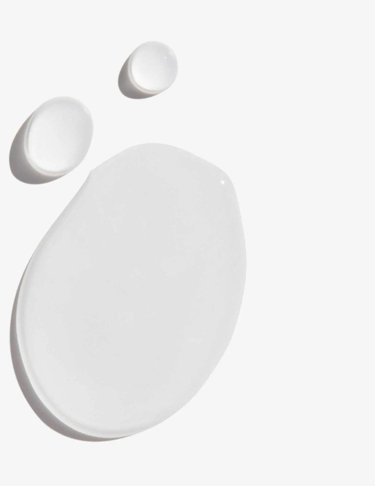 Frizz Dismiss Instant Deflate Oil-in-serum texture with clear serum droplets on a white background.