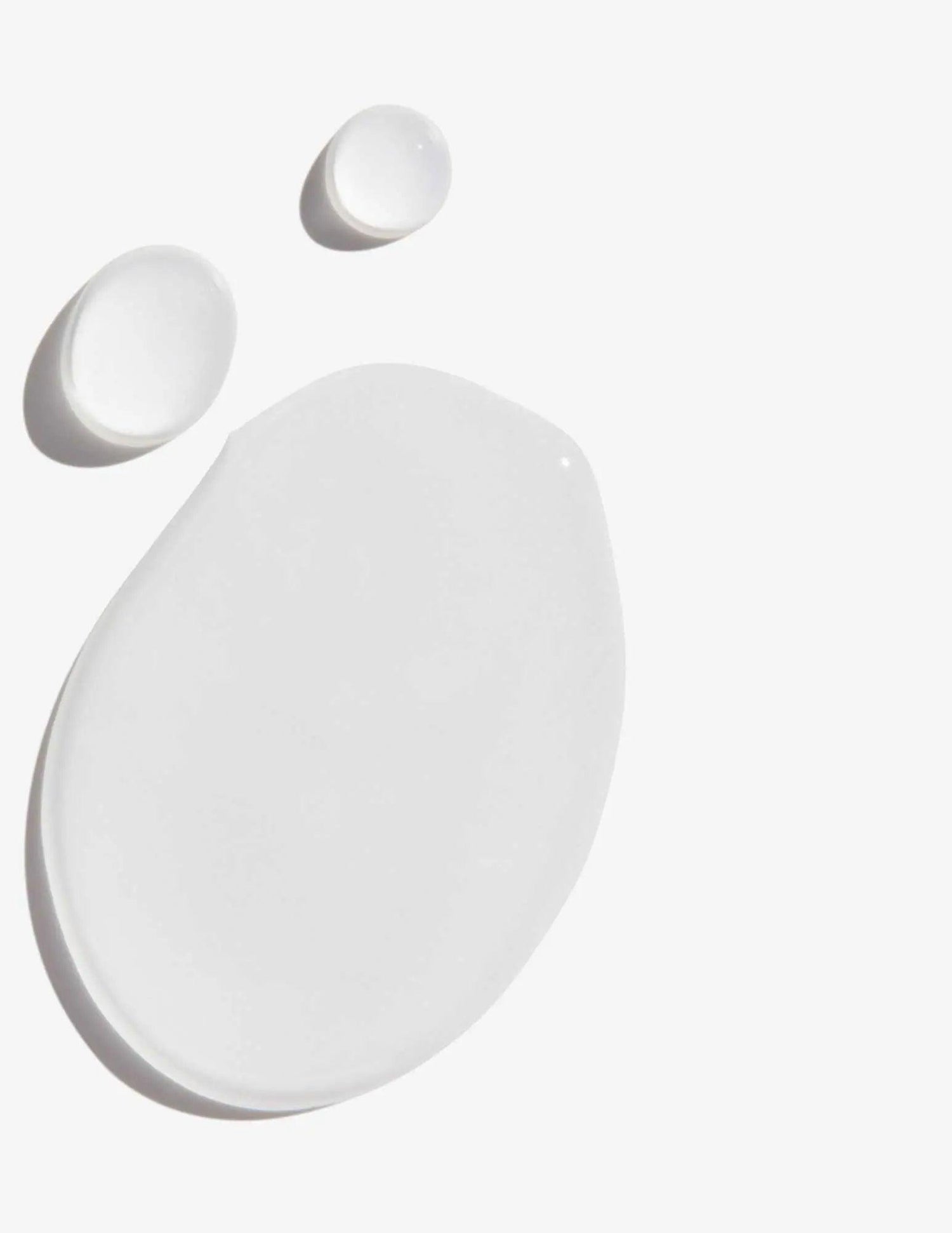 Frizz Dismiss Instant Deflate Oil-in-serum texture with clear serum droplets on a white background.