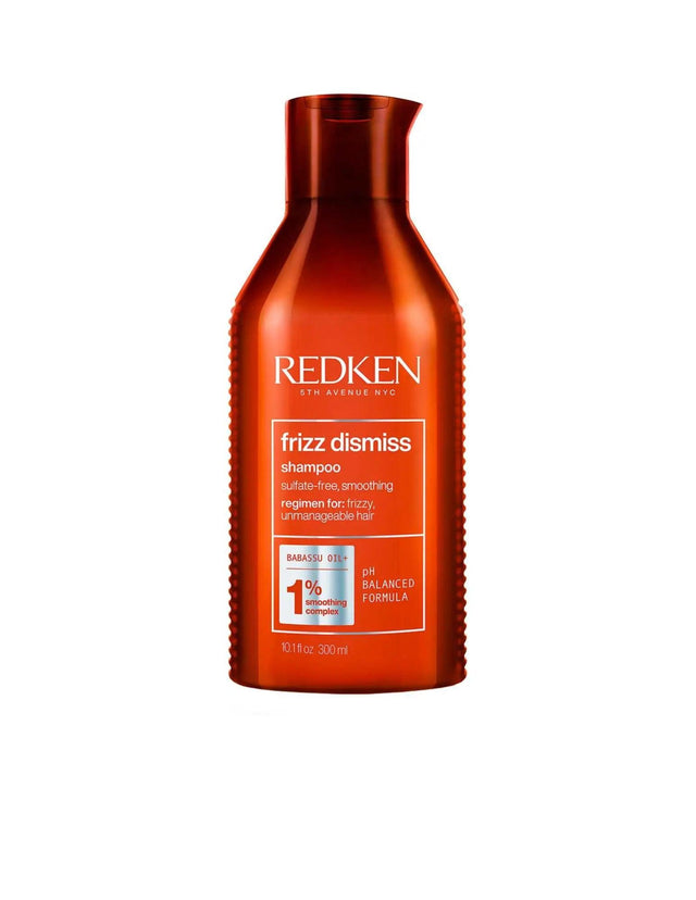 Redken Frizz Dismiss Shampoo bottle for anti-frizz and humidity control, suitable for all hair types and textures.